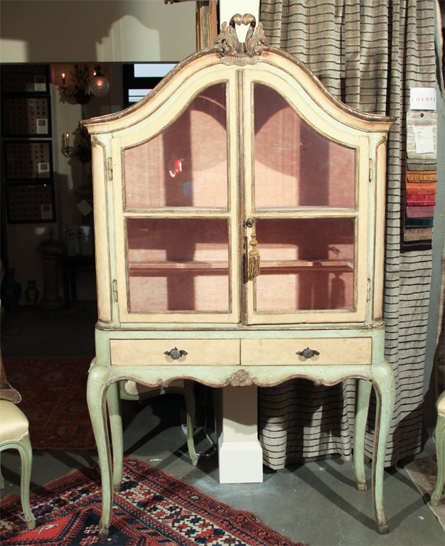 18th century vitrine from Northern Italy.  Everything is original.  The cabinet is lined with dusty pink linen velvet and the top of the outside of the cabinet is upholstered in velvet.  The 2 small drawers are lined with 18th century toile.  Lots