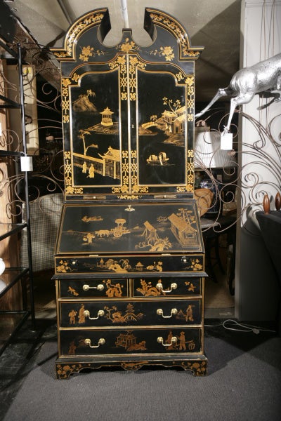 Black on the outside and Hermes orange on the inside --a beautifully lacquered chinoiserie secretary made for Maitland Smith. The interior has myriad individual drawers and cubbies. A drop front desk reveals more drawers (also lacquered orange --but
