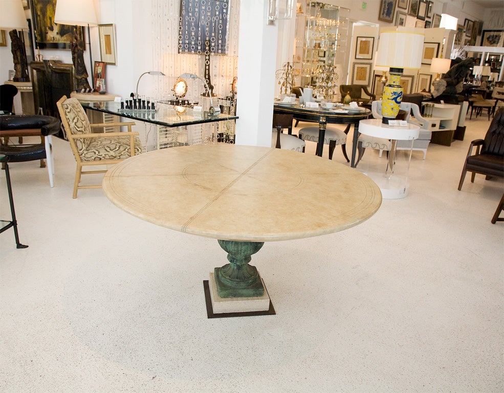 This is an original custom made neoclassical table by Billy Haines for the Palm Springs home of Jack L Warner. The round table top's geometric design showcases 8 equal sections. The wooden top retains its original finish. The top sits atop a