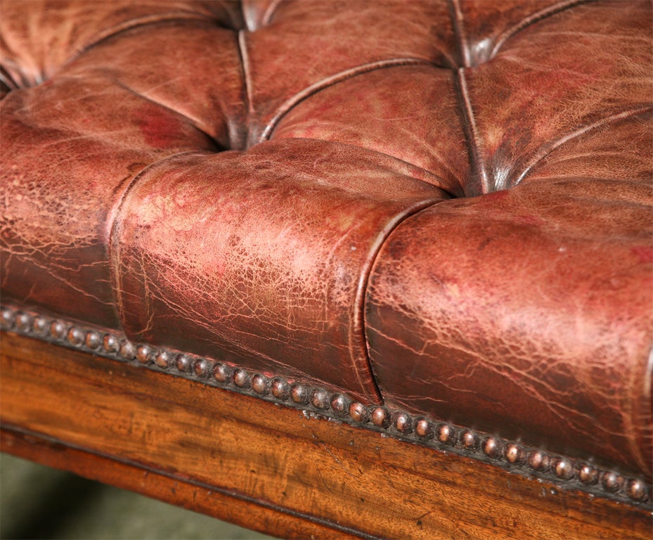 An English antique library or desk chair in mahogany