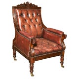 An English antique library or desk chair in mahogany