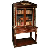 An English Regency bookcase in faux Rosewood
