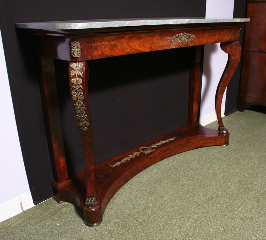 An antique French console table.