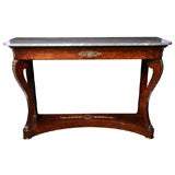 An antique French console table.