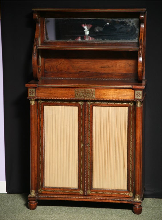 An English Antique Regency brass inlaid chiffonier.