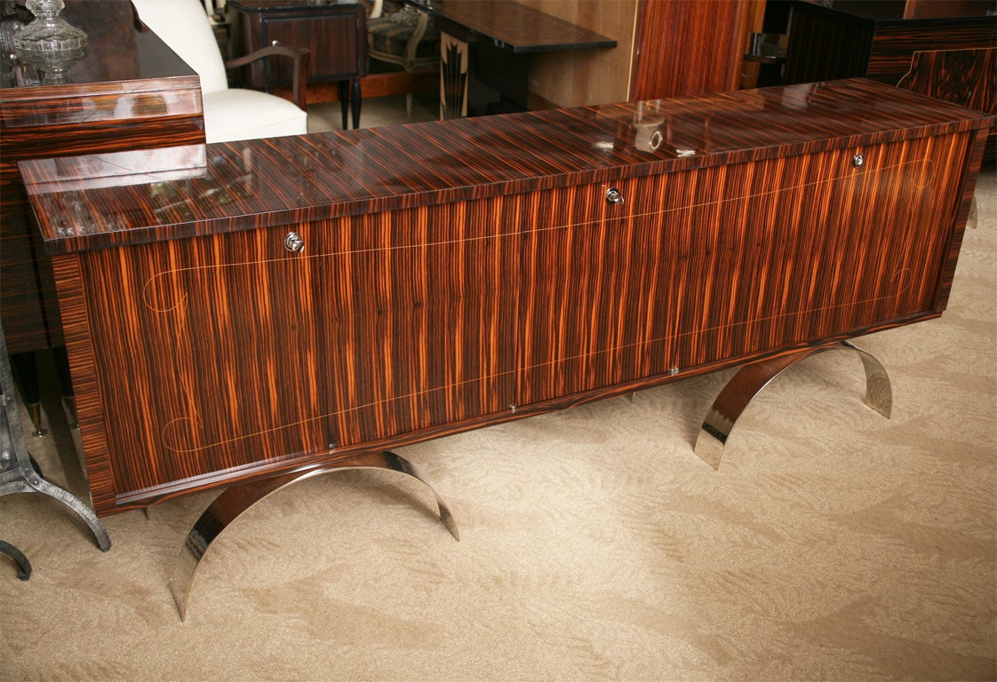 French Art Deco/ Art Moderne Macassar Ebony Sideboard/ Buffet with Outrageous Steel Barrel Legs. This is a showpiece! Finished interior/ Lemonwood, Lazy Susan/ Bar, plenty of storage space.