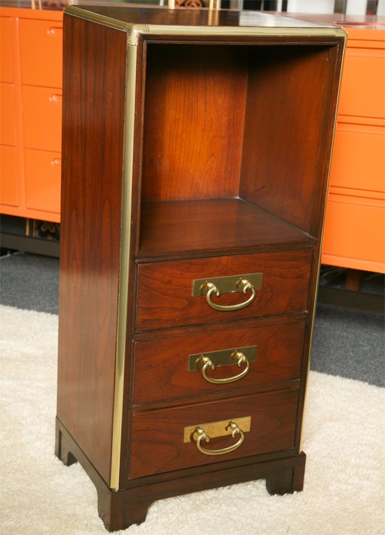 FEBRUARY 2011..Superb detail and fine cabinetmaking highlight this Baker petit mahogany, brass mounted night table.  Beautifully grained and richly finished mahogany with brass molding and tooled brass corners and elegant brass drawer pulls with a