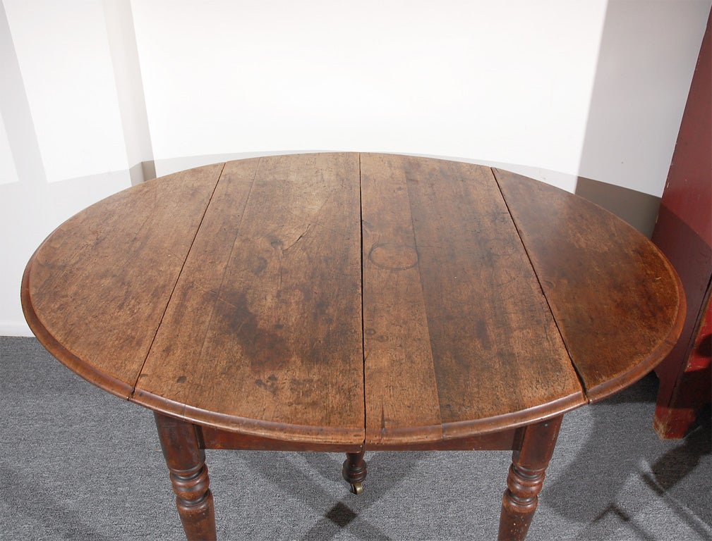 American 19THC WALNUT DROP LEAF TABLE W/ORIGINA BRASS CASTER