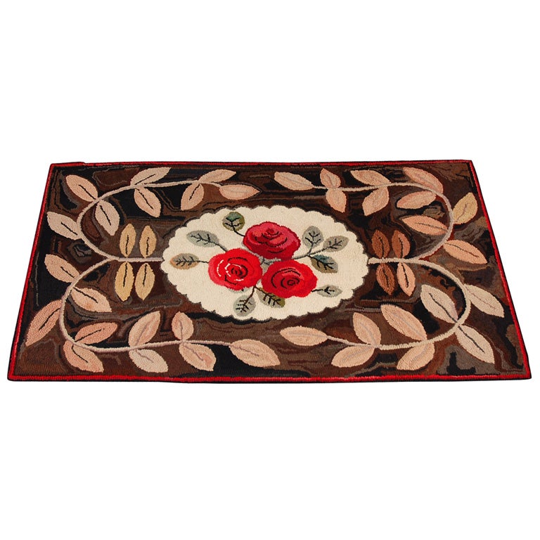 FOLKY EARLY 20THC HAND HOOKED FLORAL/GEOMETRIC RUG
