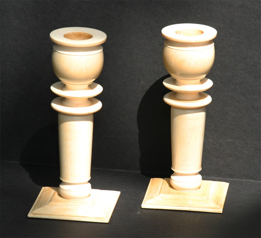A nice pair of carved ivory candle sticks made in England or one of its colonies in the 20's for demestic English use. The large thick turnings and simple decoartive elements show the deco influence. They have a nice heavy feel and show nice