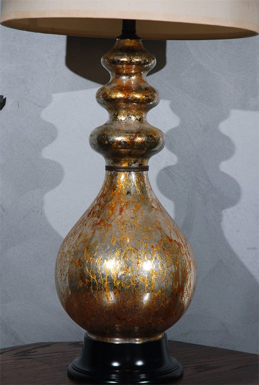A larger and impressive mercury glass vase with a bulbous body resting on a wood base. This is just the lamp to add light and interest to that certain setting. <br />
Jefferson West Antiques offer over 3,000 antique items of furniture, seating,