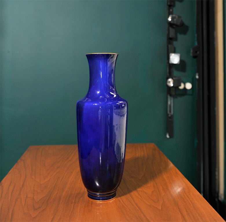 Pair of cobalt blue glazed porcelain vase by Sevres, French 1892. The interior is white and the base and rim highlighted with gold linear decoration.<br />
13