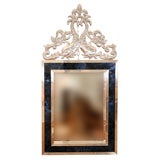 A baroque cast bronze mirror by Monique Aubert