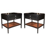 Pair of ebonized bedside tables with rattan shelves by Widdicomb