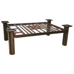 A Fine Art Deco Hammered Steel and Bronze, Parcel Gilt Low Table