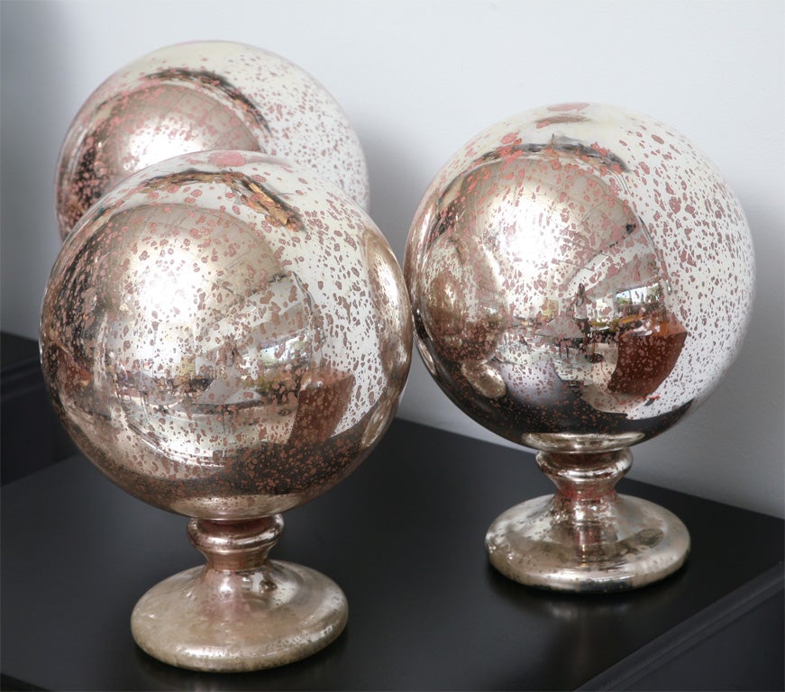 American A Group of 3 Large Mercury Glass Spheres on stands