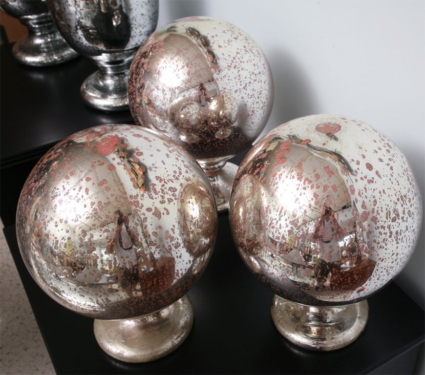 A Group of 3 Large Mercury Glass Spheres on stands 2