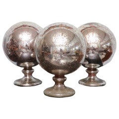 A Group of 3 Large Mercury Glass Spheres on stands
