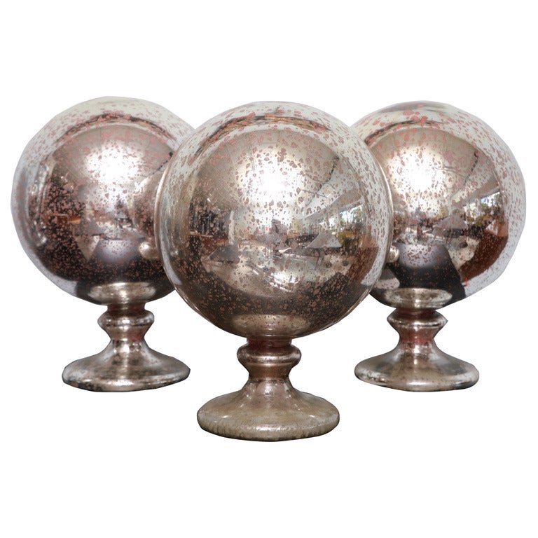 A Group of 3 Large Mercury Glass Spheres on stands