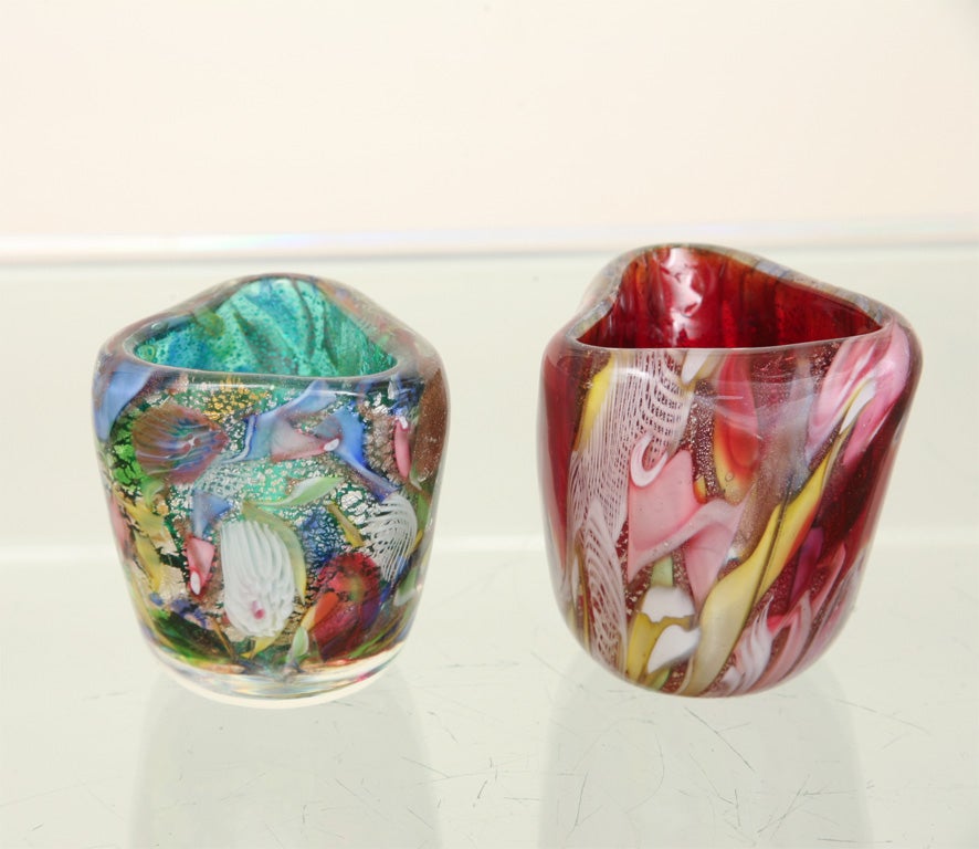 Gorgeous small Murano vessels made by A.V.E.M. called tutti frutti. Multi colored swirls comprise the outsides while the interiors show the primary solid color. Great as desk accoutrements to hold things or as displayed art glass objects. Sold as