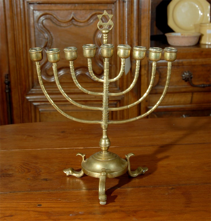 Extremely rare antique menorah from the period of Napoleon I.  Interesting mixture of styles, with the dolphin figured feet.  Found in the village of Castres, in Southwest France.