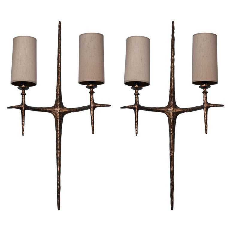 Textured bronze sconces in crucifix form with sculptural detailing. Textured silk shades. These sconces are now being produced with custom mounting plate that matches fixture, see images 6 and 7.
Lead time: 20-24 weeks.
