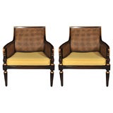 A PAIR OF CANED ARM CHAIRS ATTRIBUTED TO MAISON JANSEN