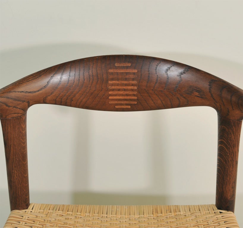 One of the most beautiful chairs ever created...Hans Wegner's Cowhorn Chair exemplifies the art of sculptural chair design.

This is an early example and is rarely available.  Two outstanding features are the curvature of the arm and the joining