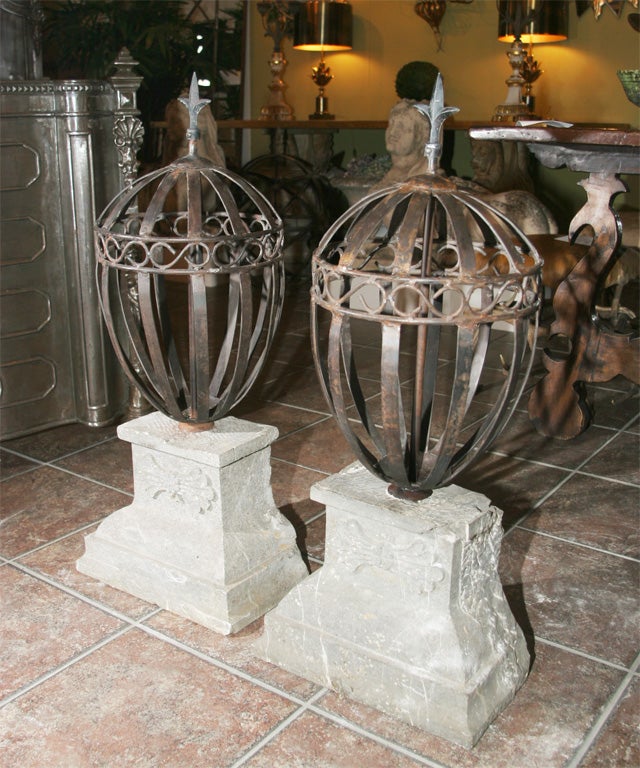 Pair of decorative metalwork and stone finials