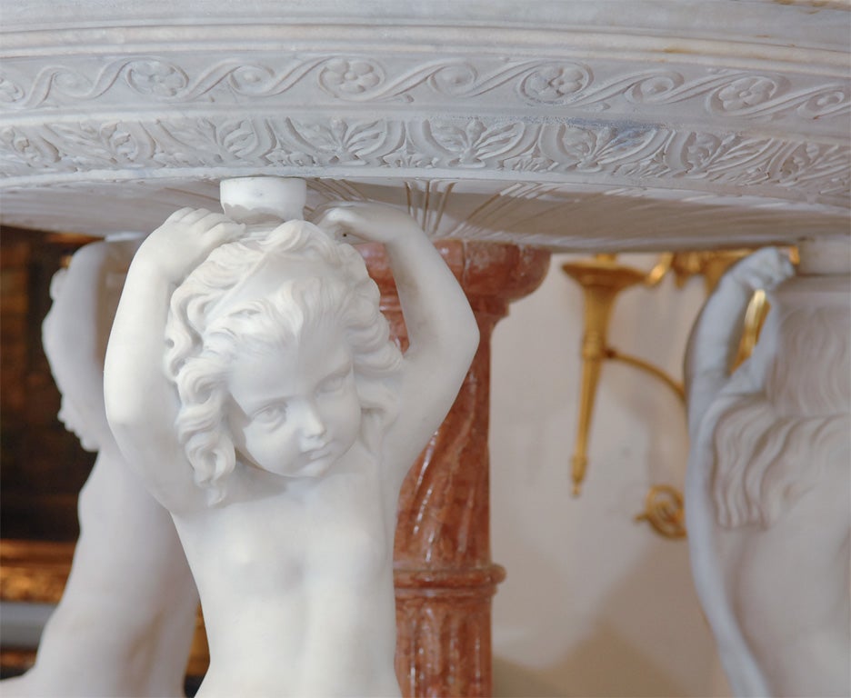 19th c Italian marble bird bath with carved cherubs.