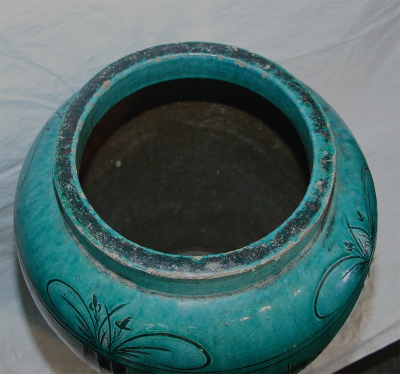 Large blue/ green glazed water jar.