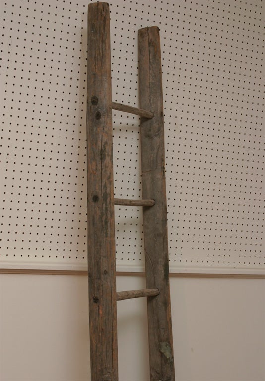 this wood Iowa farm ladder is as primitive as you can get. We have recently waxed this primitive ladder, to restore its glorious luster. There are so many uses for this piece. lean it on a wall and display magazines, or in a bathroom , with towels.