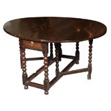 Antique 17th century English gateleg table with two drawers.