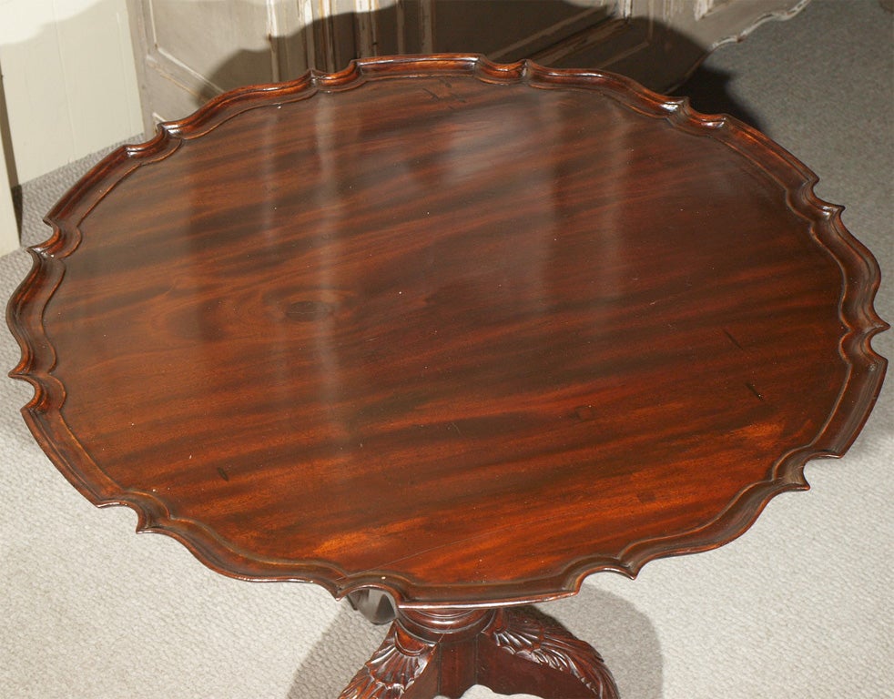 Antique English George III mahogany pie crust table.