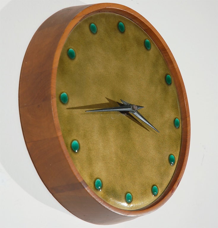 This irreplaceable, one-of-a-kind clock will warm your living room or lend beauty to your kitchen space. The combination of the topaz background, delicate glass beads, and golden wood render it a true gem. Battery-operated.