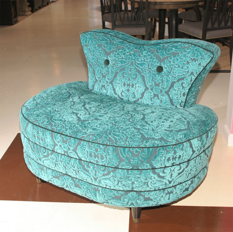 Large pouf or small settee newly reupholstered in a baroque velvet.