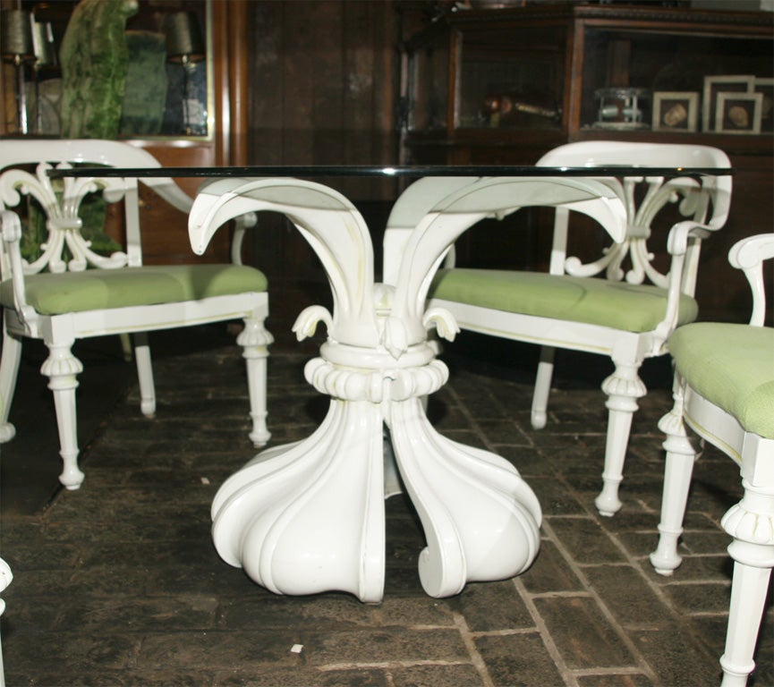 Attributed to Dorothy Draper. Enamel over cast metal chairs and spectacular lotus shaped table base. Chairs are 25