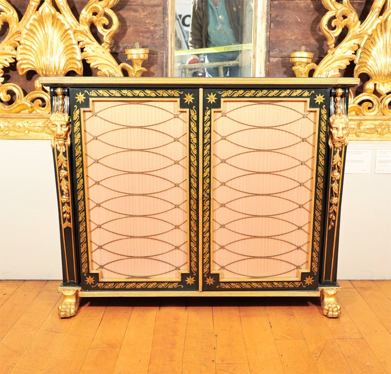 A Neoclassical Ebonized and Parcel Gilt Credenza