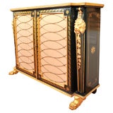 A Neoclassical Ebonized and Parcel Gilt Credenza