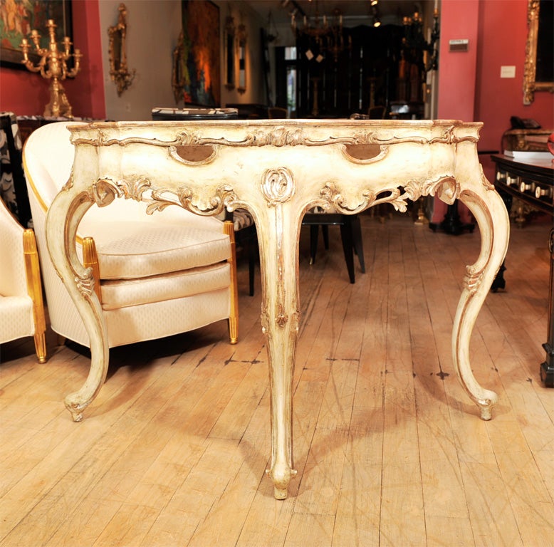 A Pair of Serpentine White Painted and Parcel Gilt Consoles
