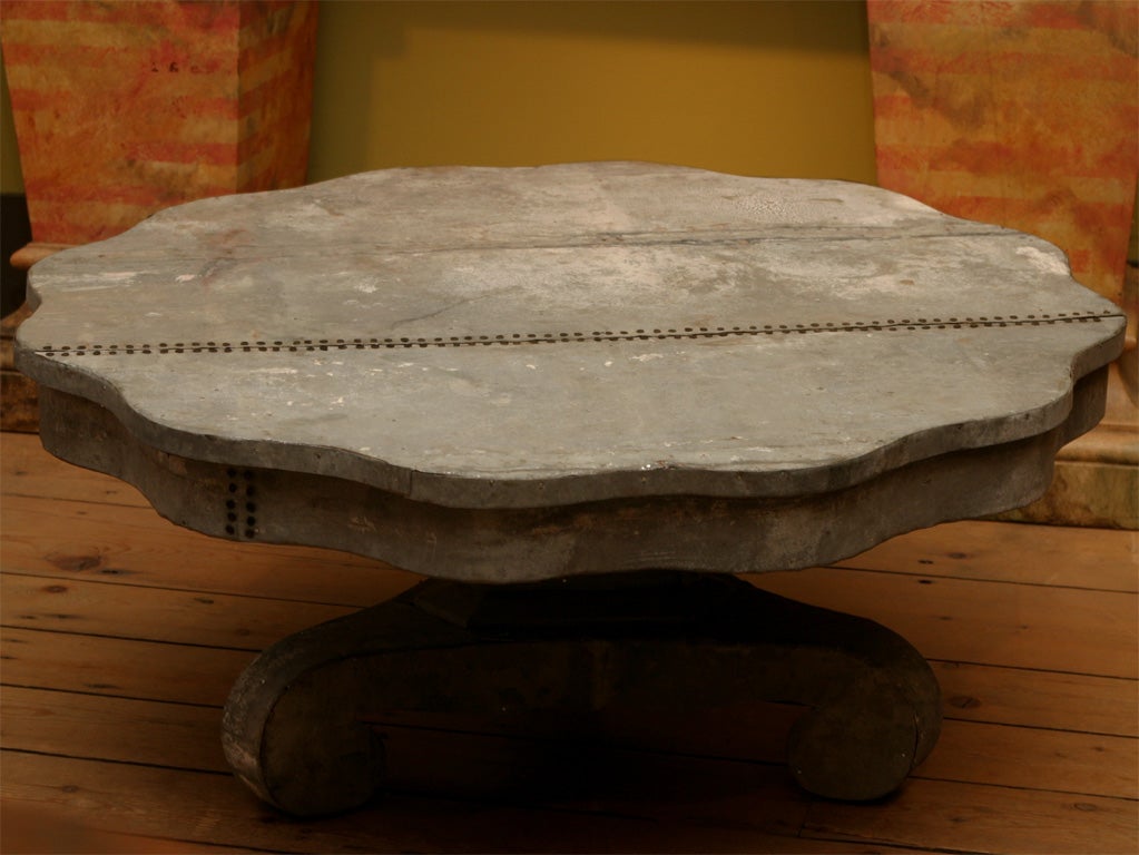 !930's Empire Style  Center Table Reduced in Height and Covered in Weathered, Nicely Aged Galvinized Tin.    Interesting Details on Top and Scrolled Feet.  Very Durable and Indestructable Coffee Table.  Large Size