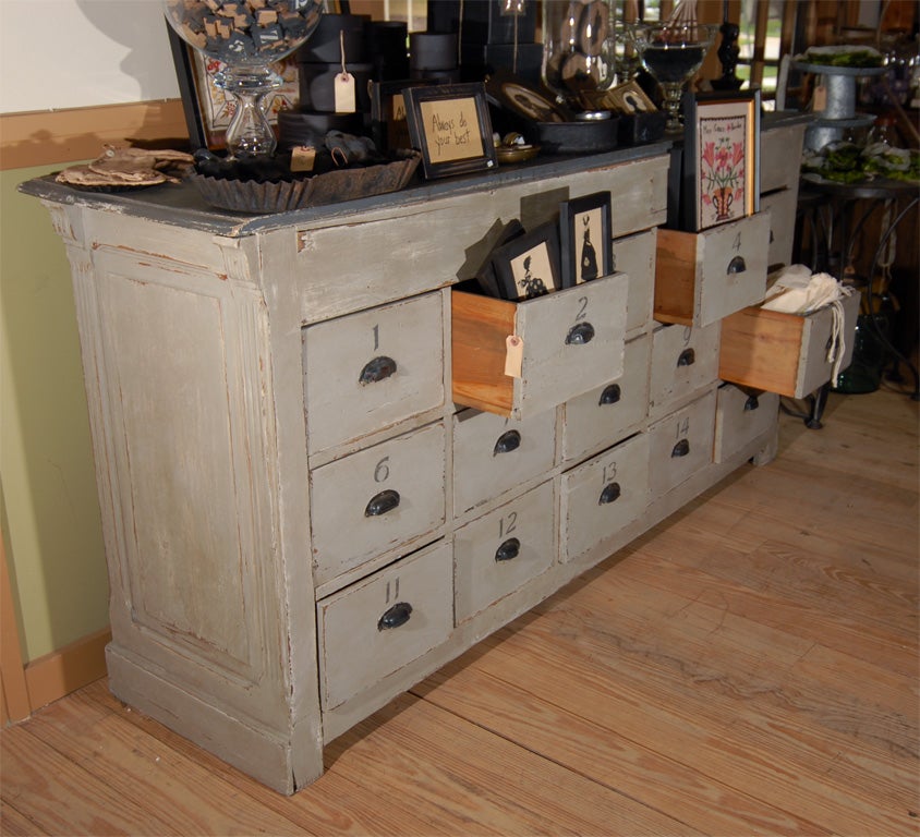 Over-painted wood store counter.  Wear commensurate with age.<br />
Last picture shows the other side of the piece.  Would make a great kitchen island or dresser