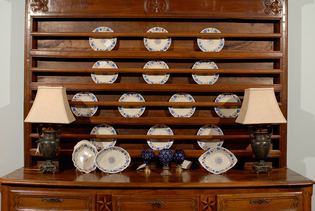 Bold cobalt blue ivy leaves with autumn gold surround a pattern of chocolate pebble like shapes on this early 19th century pattern from Spode. The unusual coloration looks particularly good with wood tones but also does well with many background
