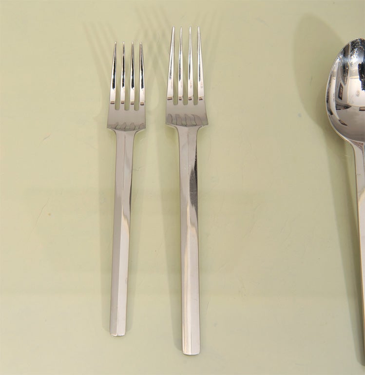 Ultra modern and sleek set includes a complete service for eight with: Dinner Knifes,Dinner forks, Salad Forks,Soup spoons,teaspoons, and three serving pieces.