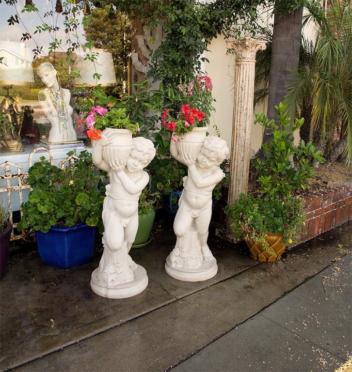 PAIR OF CHERUB BOY STATUES