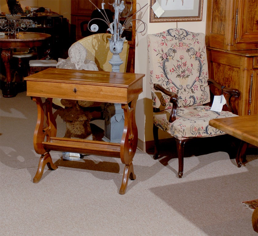 A French walnut work table with lyre shaped ends, drawer in frieze and inlay.

William Word Fine Antiques: Atlanta's source for antique interiors since 1956.