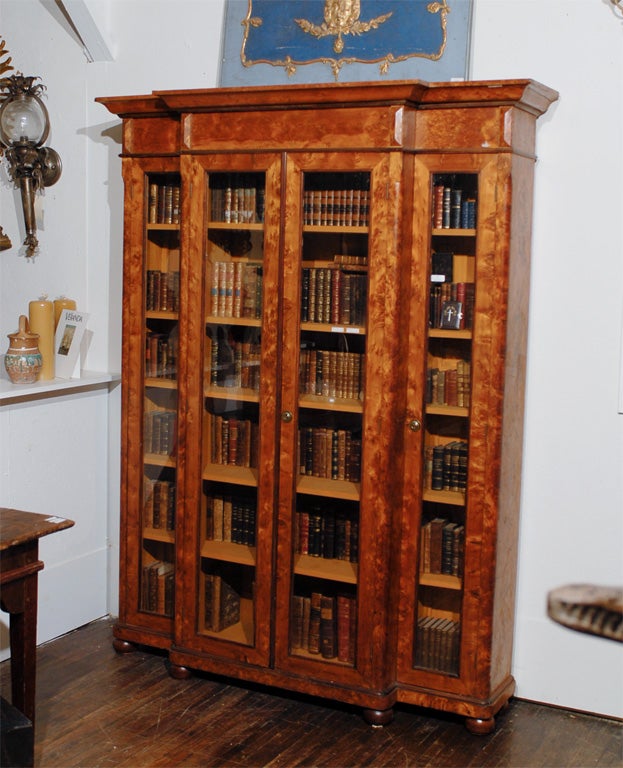 Library Cabinet with Two Center glass doors and Two Side Doors on Bun Feet, the interior with Six fixed shelves.Pre 1850