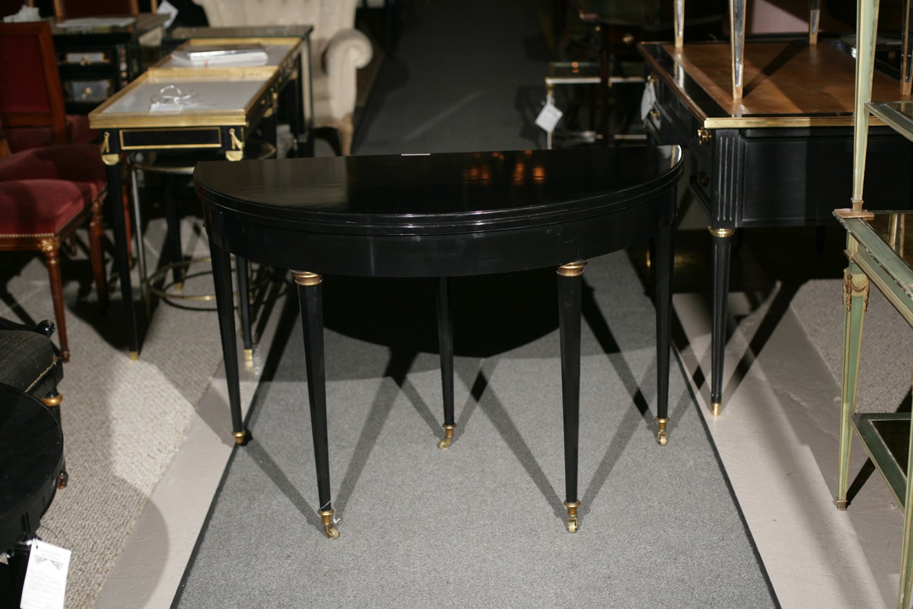 Jansen Ebonized game table with white leather interior insert