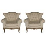 Pair of Tufted low back wing chairs stamped JANSEN