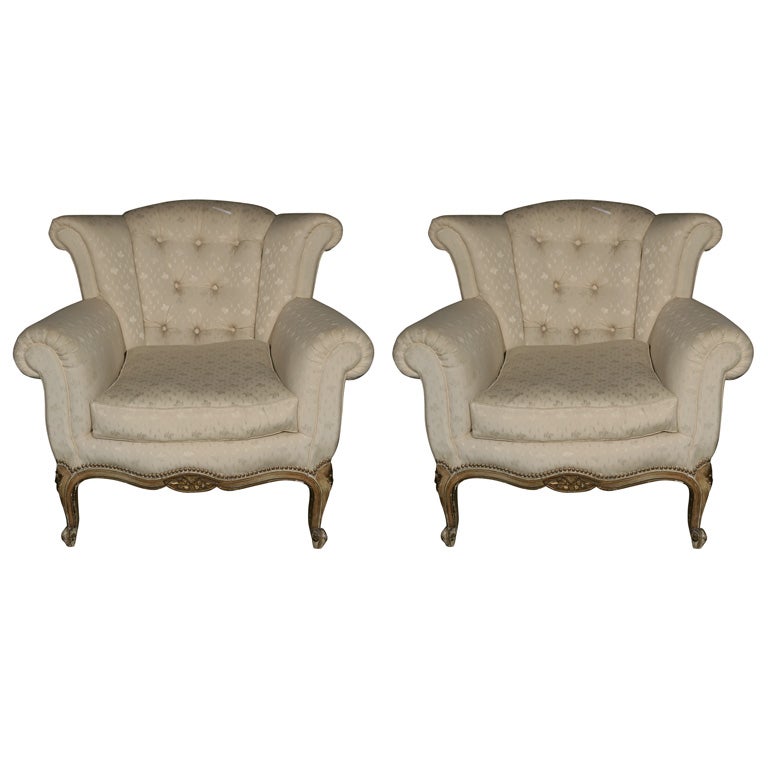 Pair of Tufted low back wing chairs stamped JANSEN